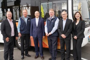 Viva Energy and CDC staff standing in front of CDC VIC bus